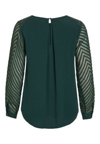 Dunkelgrüne Bluse mit transparenten, langen Ärmeln, die ein Zickzackmuster aufweisen. Knopfdetail am Rücken und abgerundeter Saum für eine fließende Silhouette.