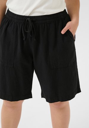 Shorts en coton noir avec une taille élastique et un cordon de serrage, dotés de deux poches avant et d'une finition texturée. Design décontracté et confortable.