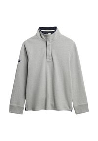 Lichtgrijze pullover met lange mouwen, een halve rits kraag en marineblauwe accenten. Gemaakt van een zachte stof met een ontspannen pasvorm en geribde manchetten.