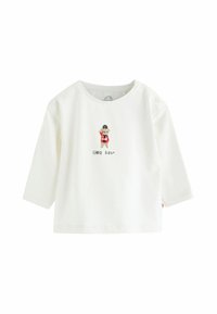 Hvid langærmet t-shirt lavet af bomuld, med en broderet bjørn og teksten "lille bjørn" nedenfor. Trykknapdetalje på skulderen.