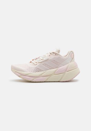 White pink running shoes