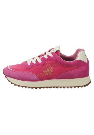 Pink suede and leather sneakers with white laces, golden logo detail, and a textured brown rubber sole. Classic athletic design.