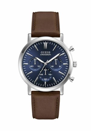 Round silver chronograph watch with dark blue dial, three subdials, silver markers, and brown leather strap.