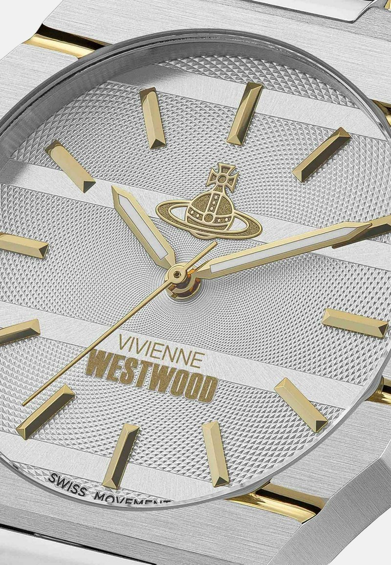 Silver watch face with gold accents, textured pattern, triangular hour markers, and the brand "Vivienne Westwood" displayed at the bottom.