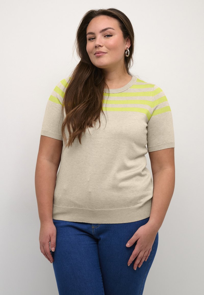 Beige short-sleeve sweater with green and gray horizontal stripes, round neckline, and a fitted shape, paired with blue jeans.
