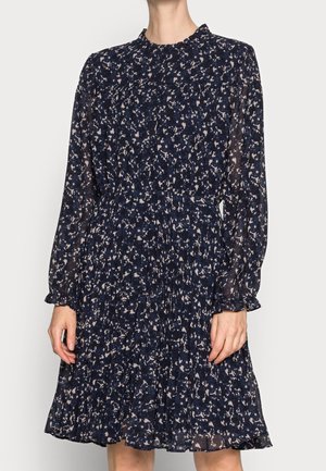 Marineblaues Blumenkleid mit langen Ärmeln, plissiertem Rock und hohem Ausschnitt. Hergestellt aus leichtem, transparentem Stoff mit einem dezenten Muster.