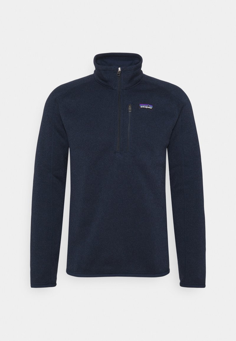 Pull polaire bleu marine à manches longues avec une fermeture éclair courte et une petite poche poitrine zippée, logo Patagonia sur la poitrine gauche.