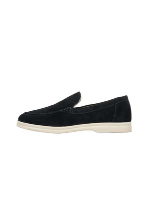 Black suede loafers with a smooth finish, low-profile white rubber sole, and stitched detailing on the upper. Simple, slip-on design.