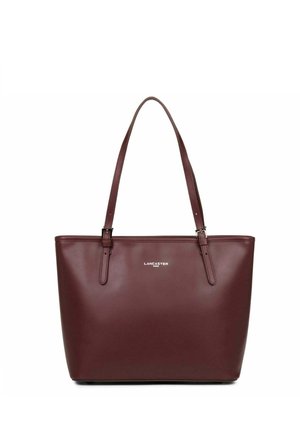 Burgundy leather tote bag with two shoulder straps, rectangular shape, smooth texture, featuring a silver logo on the front.