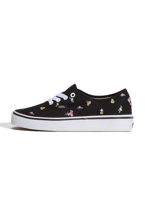 Baskets Vans basses noires avec lacets blancs, semelle blanche et petits motifs floraux roses, jaunes et blancs.