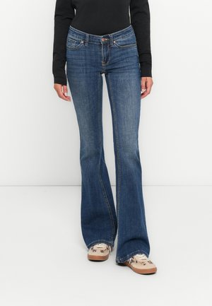 Flared blue jeans made of denim, featuring five pockets and a classic five-pocket design. The hem is slightly frayed.