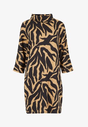 Long-sleeved dress featuring a turtleneck, made from a soft fabric in a beige color with bold black abstract zebra-like patterns.