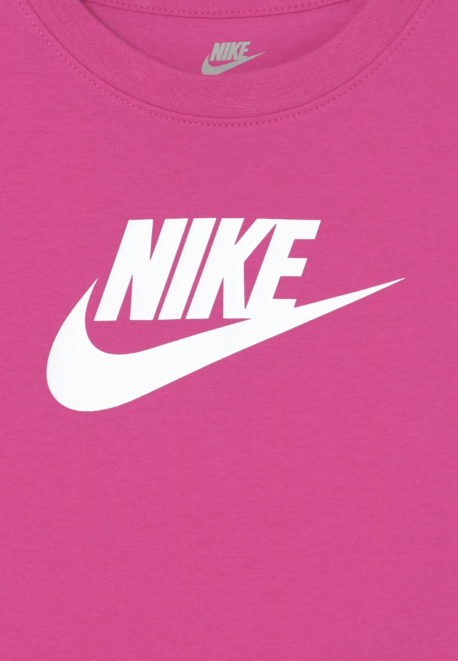 white nike shirt with pink check