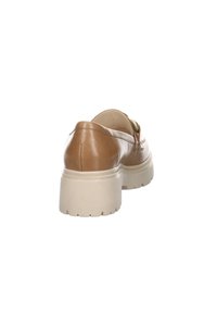 Brown leather shoe featuring a block heel, smooth texture, and a lightly cushioned insole, with beige rubber outsole for traction.