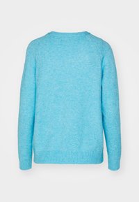 Light blue sweater featuring a crew neckline, ribbed cuffs and hem, and a soft texture. The design includes raglan sleeves.