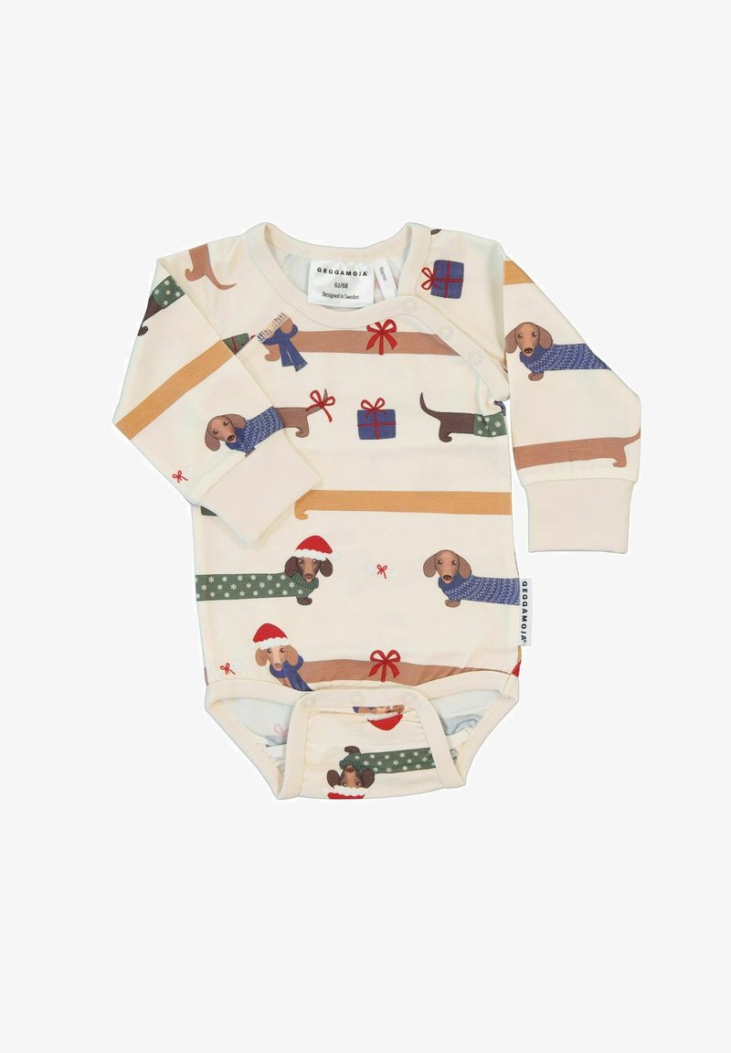 Langærmet heldragt i creme med et print af gravhundes i sweatre og juletilbehør; har trykknapper nederst for nem skift.