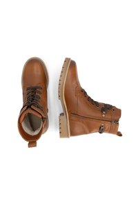 Bruine leren winterlaarzen met zwarte veters, zijrits en zachte binnenvoering, weergegeven vanuit boven- en zijaanzicht op een witte achtergrond.