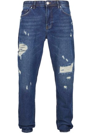 Jeans in denim blu con dettagli sfrangiati, caratterizzati da diverse aperture e bordi consumati, design a gamba dritta e stile classico a cinque tasche.