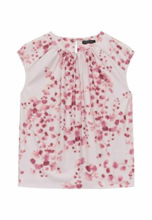 Kortärmad blus i rosa tyg med blommönster. Har veck vid halsringningen och en knäppning bak.