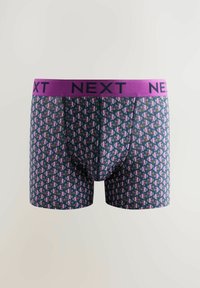 Herrenboxershorts mit navyblauem Grund und bunten geometrischen Mustern. Mit einem breiten, lila elastischen Bund mit "NEXT"-Branding.