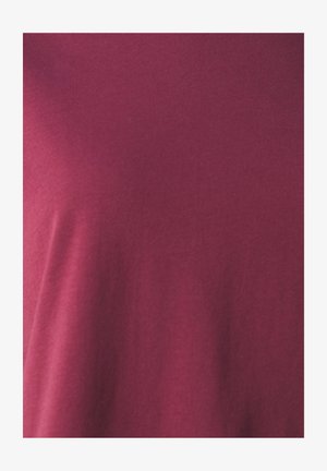 Maroon cotton t-shirt featuring a smooth texture and a basic crew neck design, with a fitted silhouette and minimal detailing.