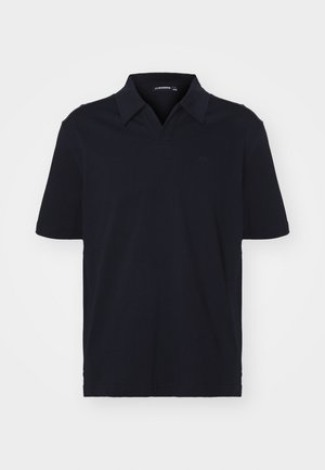 Marineblå kortermet polo skjorte laget av bomull, med klassisk krage og en subtil logo på brystet. Glatt tekstur, normal passform.