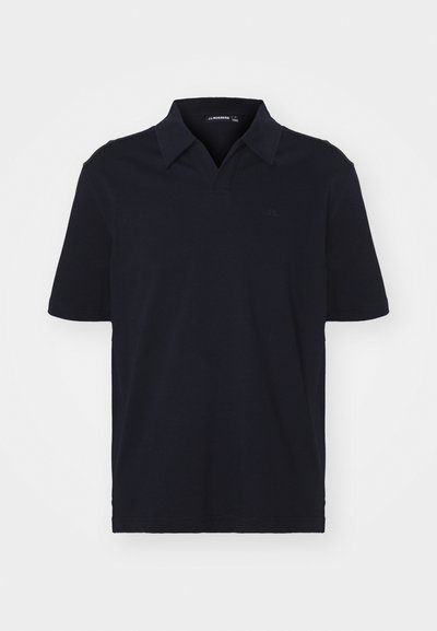 Marineblå kortermet polo skjorte laget av bomull, med klassisk krage og en subtil logo på brystet. Glatt tekstur, normal passform.