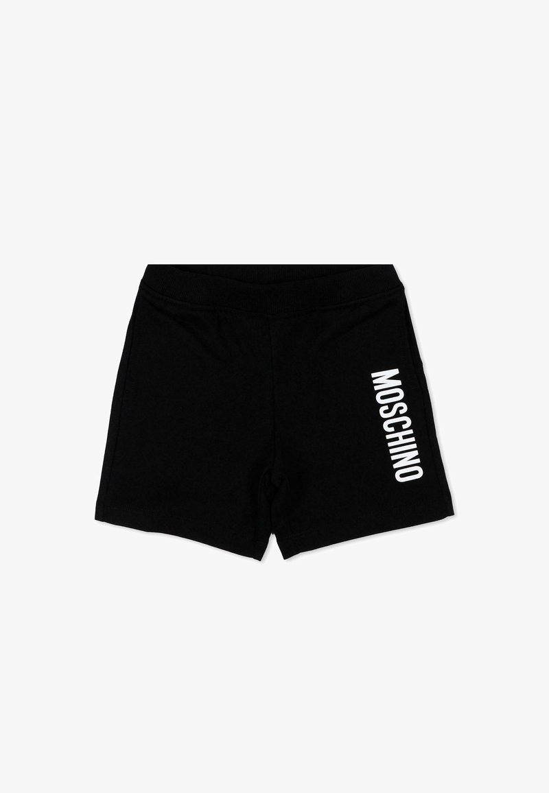 Shorts noirs avec taille élastique, comportant un logo vertical blanc "MOSCHINO" sur la jambe droite, posés à plat sur un fond blanc.