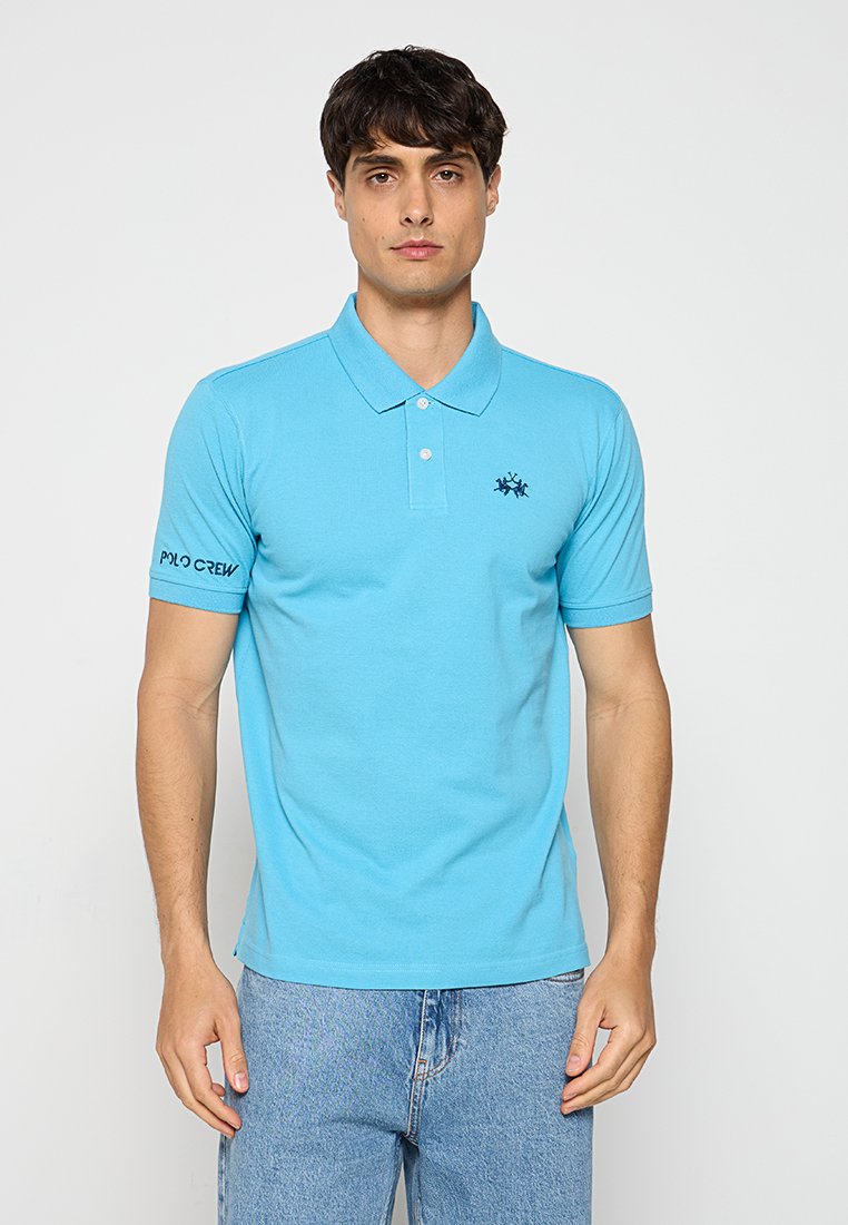Lichtblauw polo shirt van katoen, met een klassieke kraag, korte mouwen en geborduurd logo op de borst en de mouw. Casual fit.
