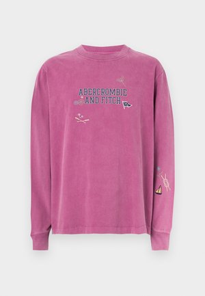 Roosa pika varrukaga pusa, millel tikitud "Abercrombie and Fitch" logo ja varrukatel erinevad mereteemalised detailid. Pehme puuvillane materjal.