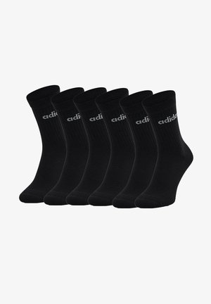 Schwarze Baumwollsocken, sechs Paar, gerippte Textur, Knöchellänge, mit einem grauen adidas-Logo auf jeder Socke. Minimalistisches Design, keine Muster.