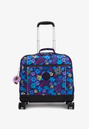 Valise à roulettes avec motif floral coloré bleu, violet et jaune, poignée extensible, poche avant zippée et petit porte-clés singe violet.
