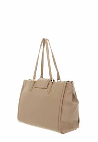 Sac fourre-tout beige au design structuré, réalisé en matériau lisse. Il dispose de deux longues poignées et d'une poche avant discrète avec des ferrures dorées.