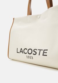 Lacoste HERITAGE  - Tote bag - natural/tan