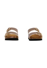 Sandales brunes à enfiler avec deux sangles réglables, boucles en ton or, semelle en liège et semelle en caoutchouc noire. Design plat pour le confort.