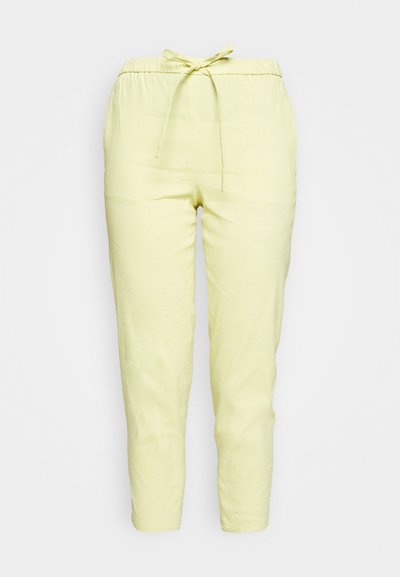 Calças de linho amarelo claro com cintura elástica e cordão ajustável. Design de perna afunilada, textura suave, sem padrões ou detalhes visíveis.