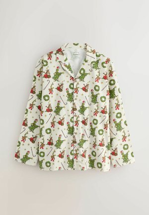 Long-sleeve pajama top in white with green and red festive cartoon designs, including Christmas trees and wreaths. Cotton fabric, button closure.