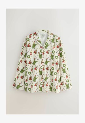 Langärmliges Pyjama-Oberteil in Weiß mit festlichen, grünen und roten Cartoon-Motiven, darunter Weihnachtsbäume und -kränze. Aus Baumwollstoff mit Knopfverschluss.
