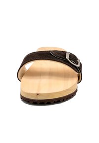 Brown suede slide sandal with a single strap and silver buckle, featuring a wooden base and textured sole for grip.