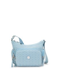 Light blue shoulder bag made of textile with a geometric pattern, featuring a main compartment, front pocket, tassel accent, and adjustable strap.