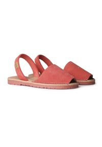 Coral suede sandals with open-toe design, slingback straps, and flat soles. Features stitching along the edge for durability.