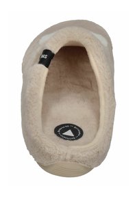 Light beige slipper with soft, fluffy texture, rounded shape, and a black label inside. White accents on the upper edge and a circular sole design.