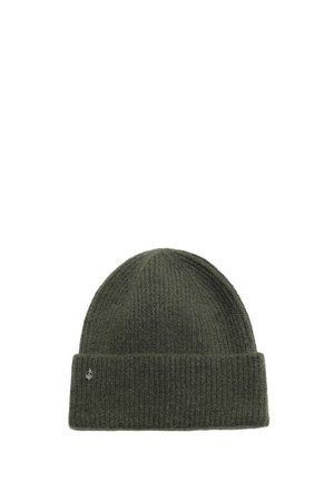 Dark green ribbed knit beanie hat with folded cuff and small silver emblem on the cuff's left side.