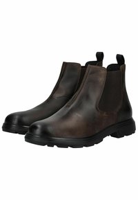 Botas Chelsea de cuero marrón con paneles laterales elásticos, punta redonda y una suela de goma texturizada para mayor tracción. Lengüetas para facilitar el uso.