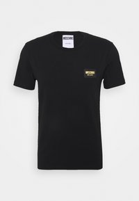Black cotton t-shirt with short sleeves, featuring a rectangular gold and black logo patch labeled "MOSCHINO MILANO" on the chest.