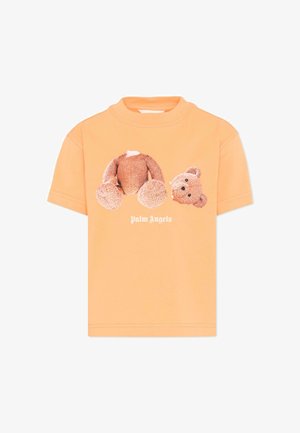 Camiseta naranja de manga corta con un gráfico de un oso de peluche decapitado y el texto "Palm Angels" debajo.
