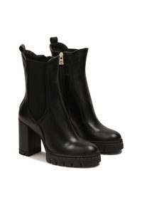 Black leather ankle boots with a chunky block heel, elastic side panels, and front zipper. Textured sole for grip. Smooth finish.