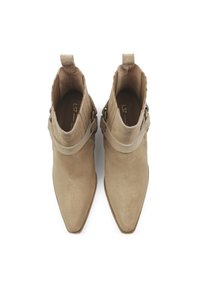 Beige suede ankle boots with a pointed toe, buckle accents, and a smooth texture, featuring two pull tabs for easy wear.