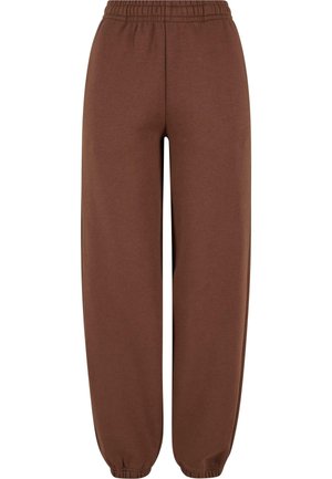 Bruine joggingbroek van zachte stof, met een elastische tailleband, taps toelopende enkels en een relaxte pasvorm. Opzettelijk minimalistisch ontwerp.