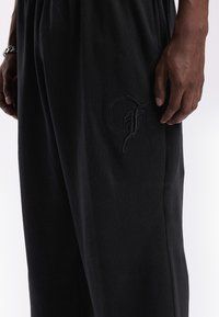 FAVELA DART JOGGER UNISEX - Tracksuit bottoms - black